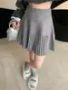 Falda plisada de estilo francés de cintura alta con cintura elástica, silueta en A y tejido de hilo de punto, nueva colección otoño/invierno 2026 para mujer
