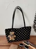Bolso de mano, bolso de hombro y bolso de axila nuevo estilo coreano, de nicho y exquisito para el trabajo, con diseño de bolsa tote de lunares para mujer, 2026