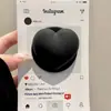Suporte Magnético Preto em Formato de Coração Tridimensional Estilo Coreano Compatível com Celulares Magsafe, Forte Adsorção para Uso em Mesa, Gadget para Pessoa Preguiçosa