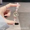 Nuevo y moderno reloj de pulsera con perlas de colores en forma ovalada, estilo de extracción de longitud libremente ajustable para mujer, de cuarzo, exquisito y compacto