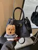 Bolso Cubo de Mano de Alta Gama Estilo Coreano Transfronterizo para Mujer 2026 Nueva Moda Versátil Textura de Alta Calidad Bolso de Hombro Cruzado