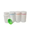 Garrafas plásticas sólidas brancas feitas sob medida para produtos de saúde com gráficos impressos e tampas multicoloridas, garrafas seladas para embalagem de cápsulas probióticas