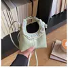 Nueva colección de verano 2026: bolso de hombro pequeño, bolso cruzado y bolso de mano elegantes y chic con diseño en forma de nube para mujer