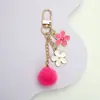 Ins estilo japonés flor de cerezo llavero colgante corazón de chica linda hueco cadena de teléfono funda para auriculares decoración de bolsa
