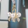 Pendientes de aguja de plata S925 con forma de lazo, perla y diamantes de Corea del Sur. Nuevos y exquisitos, dulces, sencillos y de estilo frío.