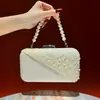 Nuevo bolso de mano para mujer, un clutch sofisticado con un toque de alta gama, versátil y exquisito, con una cadena de cuentas, un bolso de noche a la moda y un bolso cruzado para ocasiones formales