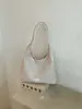 Tendência transfronteiriça grande capacidade textura tecida bolsa de axila feminina 2026 nova moda retrô bolsa de ombro única bolsa tote feminina