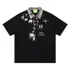 Camiseta Polo Estilo de Rua Americano Estampa de Desenho Animado com Salpicos de Tinta Verão 2026 Gola Xadrez Patchwork Roupas Masculinas de Manga Curta