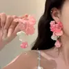 Brincos florais de nicho retrô modelo novo 2026, luxo leve, brincos que afinam o rosto, férias na praia, tarrachas de alta qualidade estilo Hong Kong