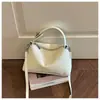 Bolso de mano retro de moda tipo almohada para mujer, nuevo bolso cruzado de nicho para el día a día 2026, bolso cruzado versátil de alta gama