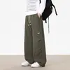 Pantalones rectos con corte curvo para hombre, nuevo estilo otoño 2026, corte holgado, pantalones largos fluidos, pantalones casuales versátiles de pierna ancha para adolescentes