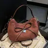 Bolso Retro de Ante tipo Dumpling Estilo Coreano Ins2026 Modelo Nuevo para Compras y Viajes, Bolso de Hombro Versátil con Lazo