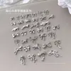 Joyas para decoración de uñas de aleación roja de Internet con forma de lazo explosivo oro y plata hueco tridimensional lazo metal DIY decoraciones