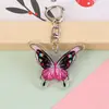 Novo Chaveiro Borboleta Colorida Fofa 2D Pingente para Mochila Escolar de Menina Acrílico Encanto Acessório de Desenho Animado Fofo