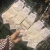 Calcetines Deportivos Blancos Cortos para Mujer Primavera y Verano Long Yixiang Calcetines Tobilleros Lindos Estilo Universitario Nuevo Modelo para Hombre 2025