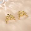 E41 Señora Chen Shuting Hoja Alta Mismos Aretes Diseño Elegante de Lujo Ligero Nudo Shu Aretes de Oro de 18K