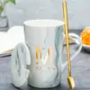 Taza Cerámica Taza con Tapa Cuchara Hogar Oficina Pareja Taza de Té Taza para Beber Taza de Café Puede Imprimir Logo Patrón