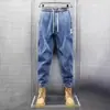Calças de trabalho jeans stretch masculinas folgadas afuniladas casuais masculinas para canteiro de obras resistentes ao desgaste calças de trabalho de proteção ao trabalhador