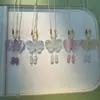 Collar colgante de mariposa ojo de gato transparente como el hielo, cadena de clavícula de mariposa pequeña de doble cara, colgante de mariposa de vidrio con piedra ojo de gato de luz de luna blanca