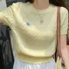 Camiseta de manga corta para mujer en verano, nueva, corte ajustado y versátil, suéter corto de punto retro amarillo retorcido, top elegante