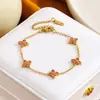 Pulsera de trébol de cuatro hojas de acero de titanio transfronteriza europea y americana más vendida con pedrería para mujer, joyería exquisita de lujo ligero, pulsera versátil de estilo europeo y americano