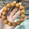 Pulsera de nuez pequeña cabeza de mono cadena de entrada de tierra pluma de fénix piel original semilla original texto cabeza de mono pulsera de un solo círculo de juego regalo