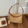 Bolso de mano para dumplings de paja tejido de alta gama transfronterizo, nuevo bolso de hombro de moda de verano 2026 para commuting, bolso cruzado tejido para debajo del brazo