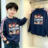 Camiseta de manga larga para niño con tres rayas, nuevo estilo primavera y otoño 2026, camiseta básica de algodón puro holgada para niños, top moderno