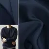 Tejido de algodón espacial negro, tejido de punto entrelazado de capa de aire liso, material para chaqueta sudadera de silueta estructurada en azul marino