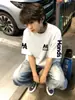 Camiseta de Algodón Pesado de Manga Corta para Hombre con Bordado de Letras de Tendencia Nacional Estilo Nuevo 2026, Top Holgado de Verano High Street