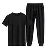Venta al por mayor de fábrica verano moda masculina casual traje tendencia Joker cuello redondo manga corta pantalón de tobillo de punta traje de dos piezas