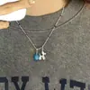 Estilo nuevo de primavera y verano, cadena para clavícula con colgante de florcitas de colores, collar para mujer con colgante de manzana roja lindo