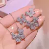 Tiktok live venta caliente collar de cadena de hueso de arco marino pendientes de botón brillantes de diamantes completos anillo traje de joyería venta al por mayor