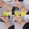 Processamento e Personalização de Pulseira Olho Mágico Popular em Vendas Transfronteiriças Aço Titânio Banhado a Ouro 18K Abertura de Mola Não Ajustável Nicho Tendência