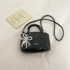 Nueva moda femenina 2026 lujo ligero elegante estilo coreano para ir al trabajo color liso bolso de hombro único bolso cruzado