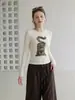 Camiseta feminina estilo coreano, cor damasco, gola redonda, manga longa, com estampa outono 2026, pode ser usada como peça externa