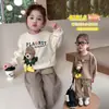 Conjunto de dos piezas de moda coreana para primavera y otoño, dulce y lindo, con sudadera de cuello redondo y pantalones jogger casuales con estampado de oso de dibujos animados para bebés