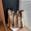 Bolso de mujer de gran capacidad con bloques de color, nuevo modelo verano 2026, bolso de hombro tejido de paja para el día a día, bolso de playa para vacaciones junto al mar