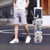 Fabricantes de origen pantalones cortos casuales para hombre verano pantalones de playa nuevo coreano suelto elástico costura etiqueta