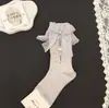 Novas meias de cano médio vazadas com strass e laço doce, meias da moda feminina, meias largas de celebridade da internet mais vendidas para primavera-verão