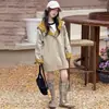 Gabardina de alta gama estilo coreano para niña 2026 primavera y otoño nueva con capucha de longitud media estilo británico casual para otoño
