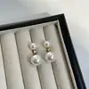 Brincos redondos de pérola requintados da Shijia, elegante estilo de luxo leve francês, versáteis e modernos, adequados para o trabalho, brincos femininos estilo ins