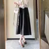 Saia em formato de botão tridimensional estilo Hepburn em tecido de lã com bolsos laterais, saia feminina elegante de comprimento médio para outono e inverno H082409