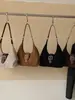 Bolso de axila de diseño nicho retro casual para el día a día 2026 transfronterizo, bolso de mano para mujer, bolso de hombro, bolso cruzado, bolso tote