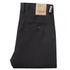 Pantalones de hombre marrones de alta gama importados con textura de sarga, nueva colección otoño/invierno, cómodos pantalones de corte recto de tiro medio para negocios casuales, gruesos