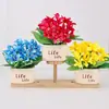 Venta al por mayor del fabricante Cuenca de vida Flor de seda artificial Girasol en maceta Flor artificial Sala de estar Escritorio del hogar Decoración Adornos florales