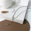 Nuevo collar de perlas de hadas de moda diseño de nicho femenino sentido de diseño cadena de clavícula de ocho puntas estrella Accesorios de estilo frío al por mayor