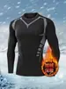 Camiseta de manga larga ajustada para hombre, estilo americano moderno, para otoño e invierno, con cuello redondo, diseño estampado, estilo deportivo casual y diseñada para acentuar los músculos, adecuada para correr y fitness