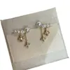 Pendientes Exquisitos de Borla y Flor de Cuatro Hojas con Perlas, Lujo Ligero Fresco y Elegante, Pendientes Nuevos Súper Elegantes de Verano 2026, Más Vendidos para Mujeres