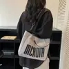 Bolso de Hombro Único de Gran Capacidad con Textura de Moda para Mujer 2025 Nuevo de Moda Estudiante Clase Viaje Diario Bolso Tote con Letras